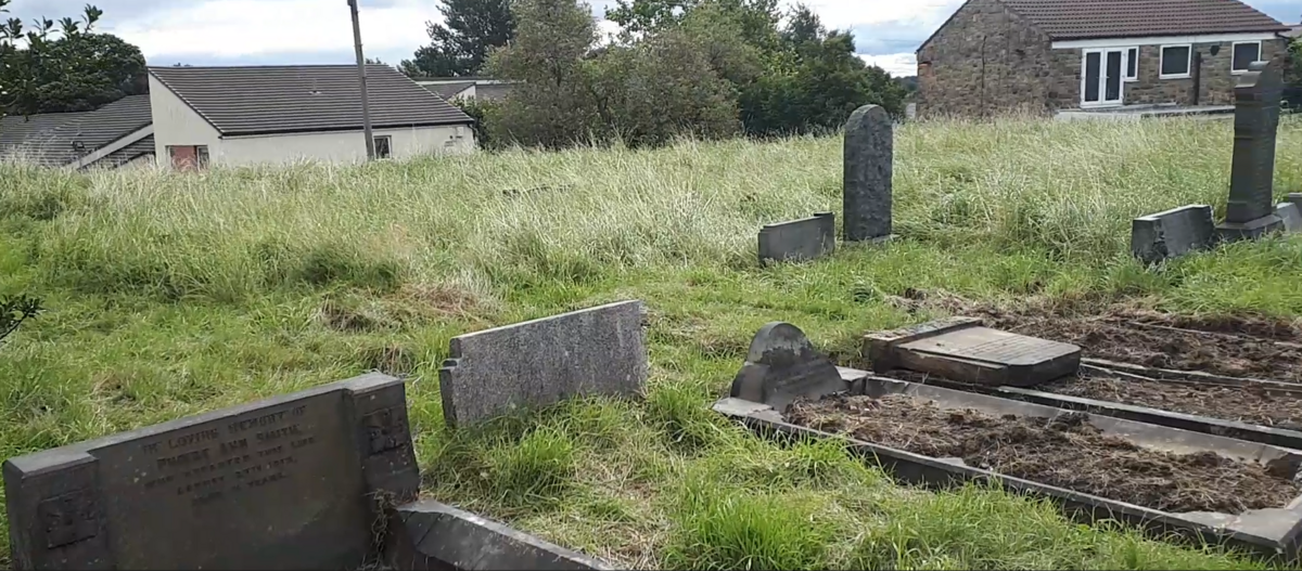 Graves being uncovered August 2020